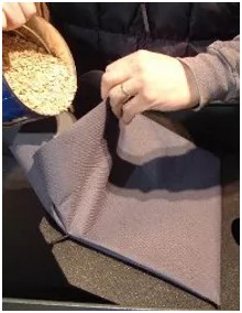 Stable Grazer Grain Pouches Person Putting Grain In It